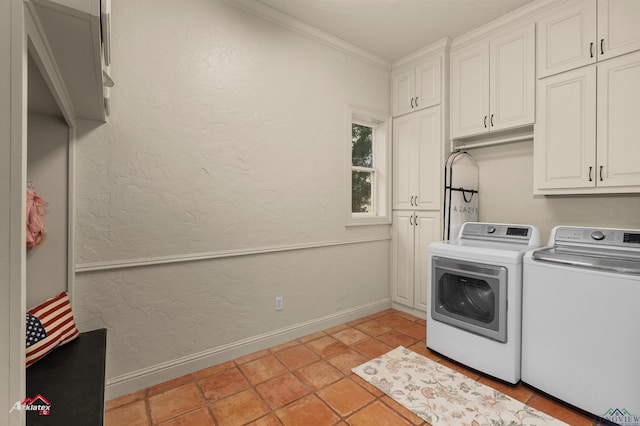 laundry room featuring cabinets, separate washer and dryer, crown molding, and light tile patterned floors