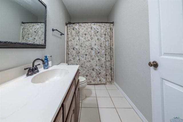 bathroom with tile patterned flooring, vanity, curtained shower, and toilet