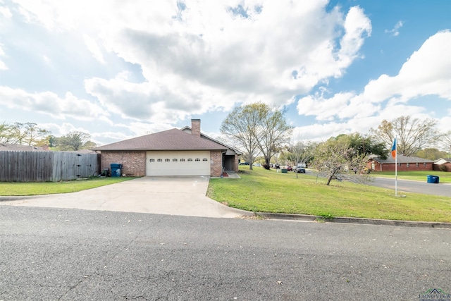 view of front facade with a garage and a front lawn