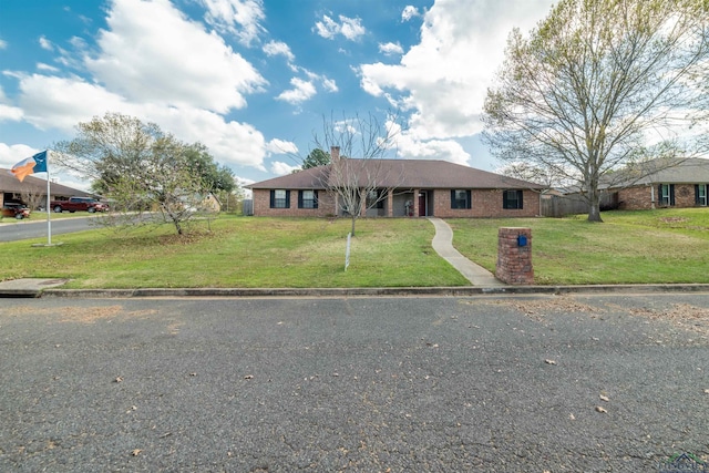 single story home with a front yard