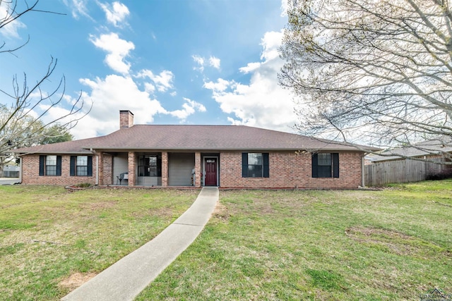 ranch-style home with a front lawn