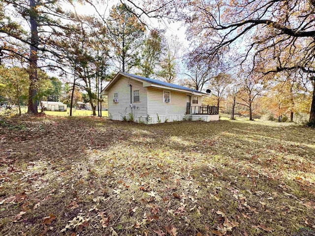 view of property exterior with a deck