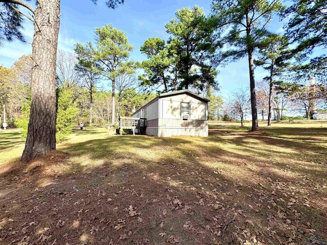 view of yard featuring a wooden deck