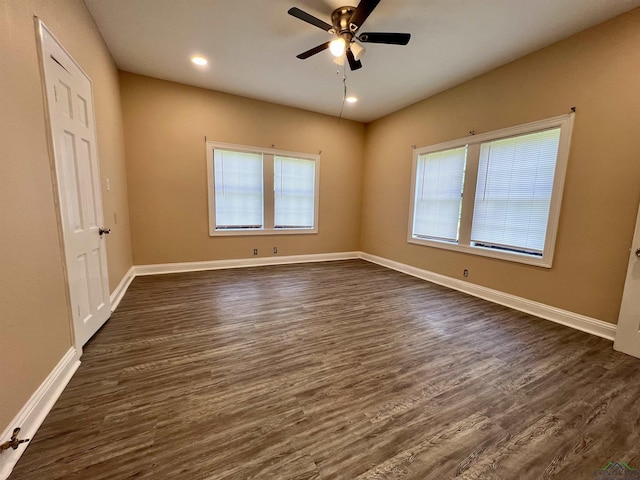 1411 E Timpson St, Longview, TX 75601 - unfurnished bedroom featuring dark wood-style flooring, baseboards, recessed lighting, and ceiling fan