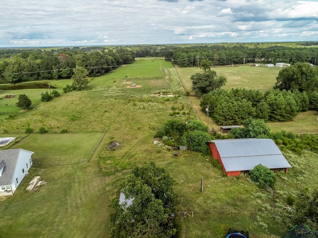 birds eye view of property with a rural view