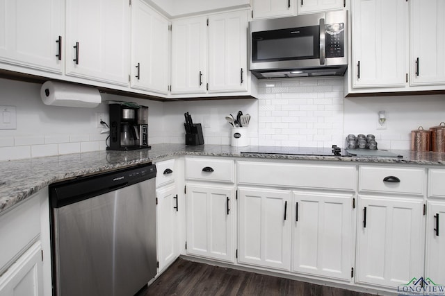 144 Hollie Cir, Sulphur Springs, TX 75482 - kitchen with appliances with stainless steel finishes, white cabinets, light stone countertops, and backsplash