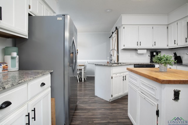 144 Hollie Cir, Sulphur Springs, TX 75482 - kitchen featuring dark wood-style floors, a sink, wood counters, white cabinetry, and crown molding