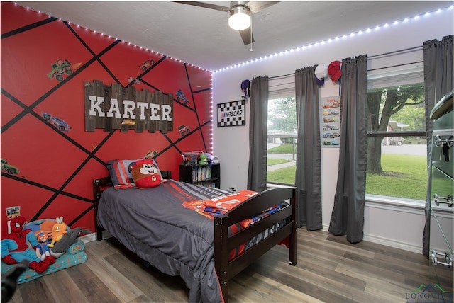 144 Hollie Cir, Sulphur Springs, TX 75482 - bedroom with wood finished floors, baseboards, and a ceiling fan