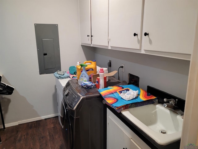 laundry room featuring electric panel, a sink, dark wood finished floors, cabinet space, and separate washer and dryer