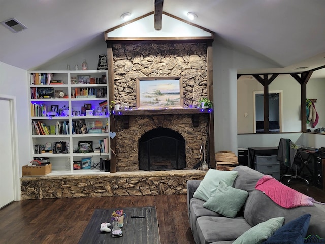 living area featuring visible vents, a fireplace, lofted ceiling, and wood finished floors