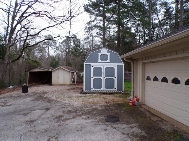 garage featuring a storage unit