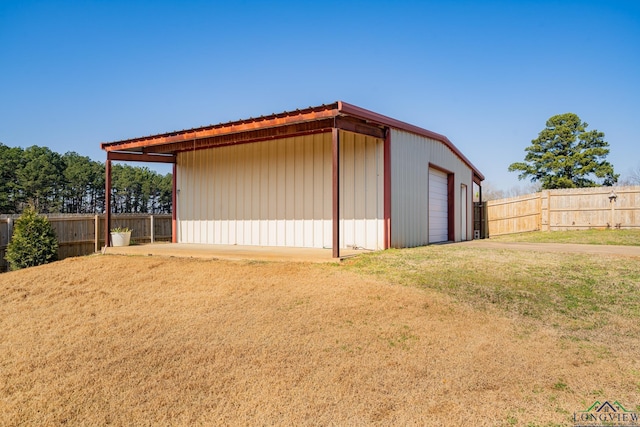 exterior space with a yard and a garage