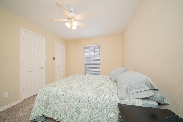 carpeted bedroom featuring ceiling fan