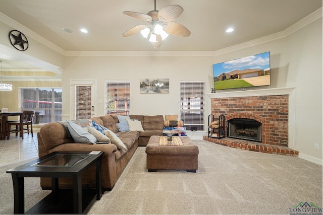 living room with ceiling fan, light colored carpet, ornamental molding, and a brick fireplace