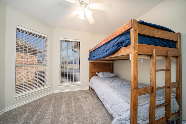 unfurnished bedroom featuring ceiling fan and carpet flooring