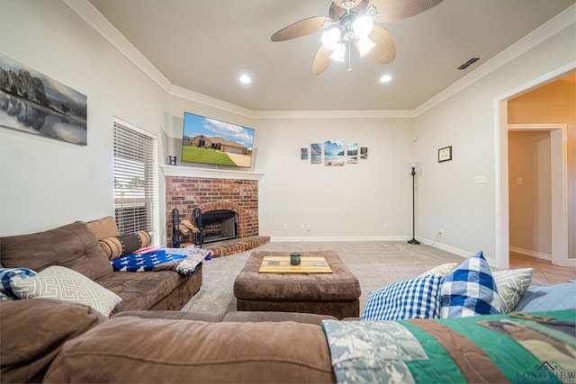 carpeted living room with ceiling fan, ornamental molding, and a brick fireplace