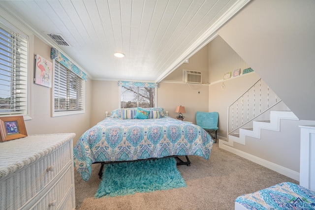 carpeted bedroom featuring visible vents, an AC wall unit, crown molding, baseboards, and wood ceiling