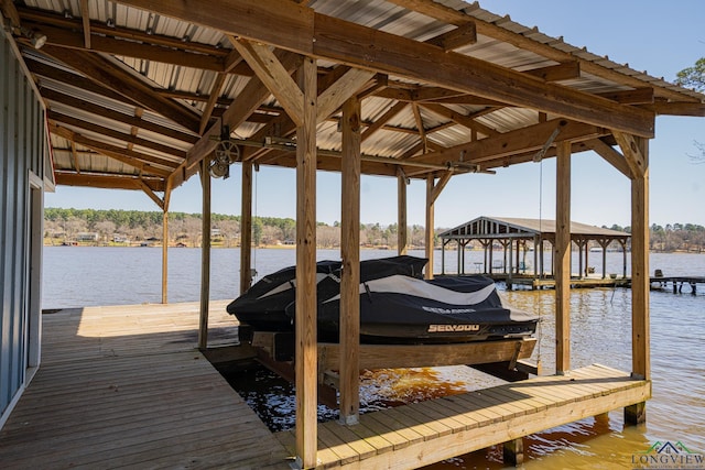 view of dock featuring a water view and boat lift