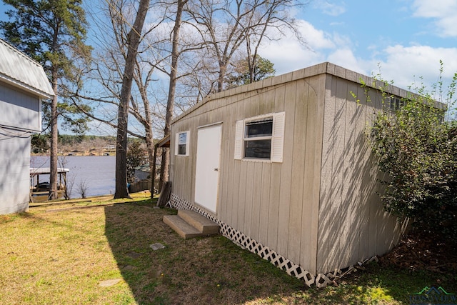 view of outbuilding featuring an outdoor structure and a water view