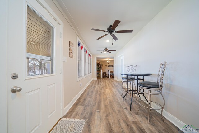 interior space featuring recessed lighting, wood finished floors, baseboards, and ceiling fan