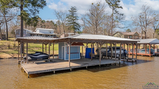 view of dock featuring a water view and boat lift