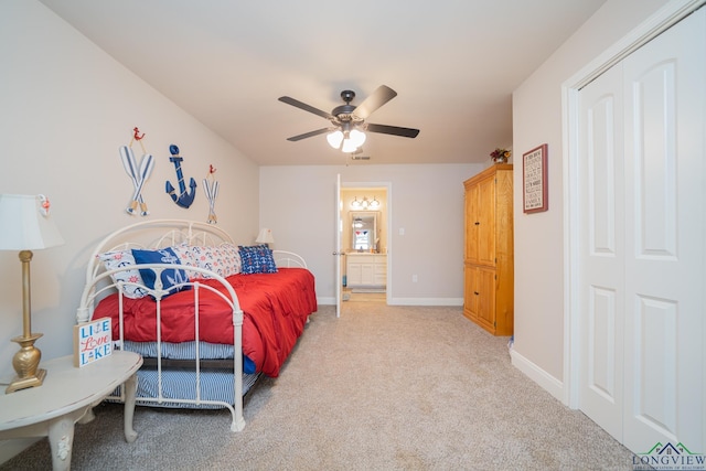 carpeted bedroom with a ceiling fan, visible vents, and baseboards