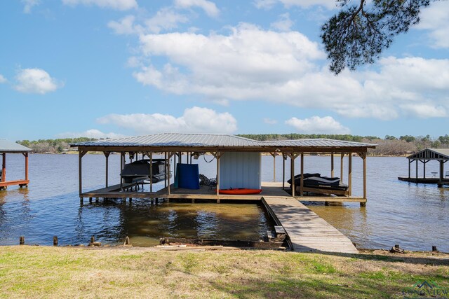 view of dock featuring a water view and boat lift