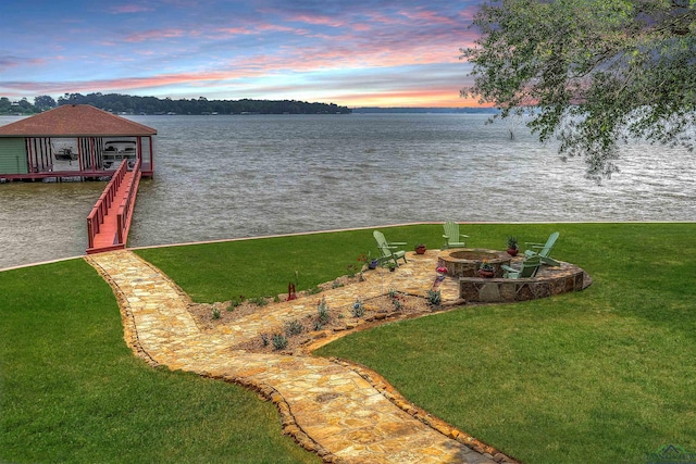 209 Rocky Point Rd, Mount Vernon, TX 75457 - view of green lawn with a water view and a fire pit