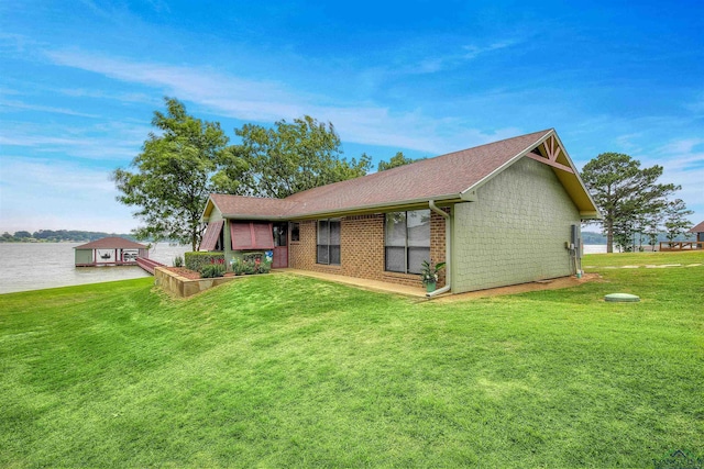 209 Rocky Point Rd, Mount Vernon, TX 75457 - back of house featuring a lawn, roof with shingles, and a water view