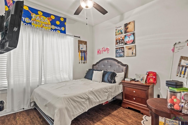 bedroom featuring ceiling fan and dark wood-type flooring