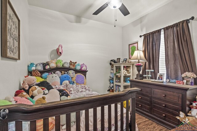 bedroom featuring wood-type flooring and ceiling fan