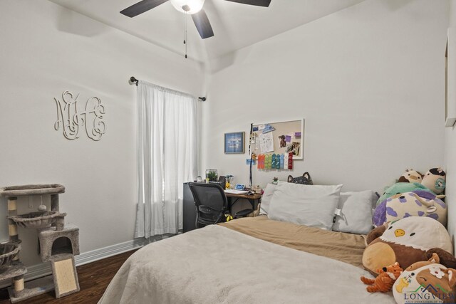 bedroom featuring ceiling fan and dark wood-type flooring