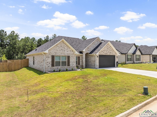 view of front facade featuring a garage and a front lawn