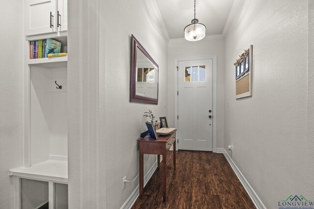 entryway featuring dark hardwood / wood-style floors and crown molding