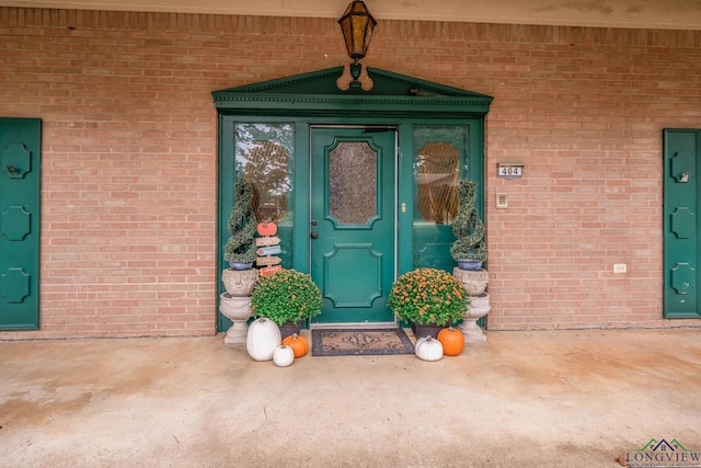 entrance to property with brick siding