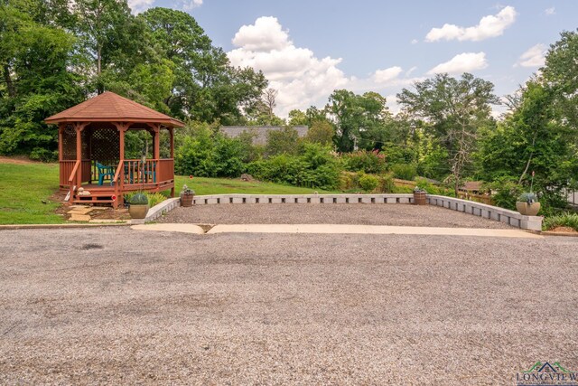 view of jungle gym featuring a lawn and a gazebo