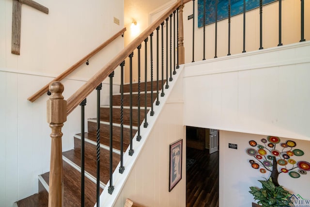 staircase featuring hardwood / wood-style floors