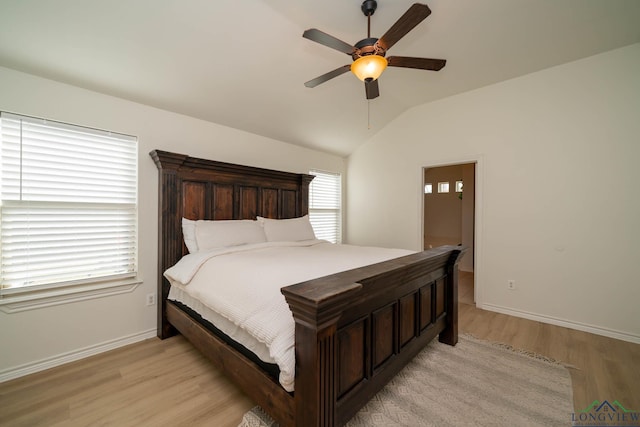 bedroom featuring vaulted ceiling, light hardwood / wood-style flooring, and ceiling fan