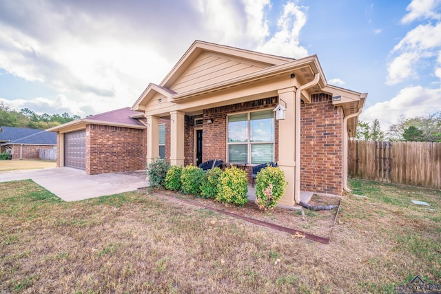 view of front of property with a front lawn and a garage