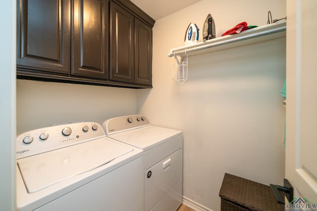 laundry area with cabinets and independent washer and dryer