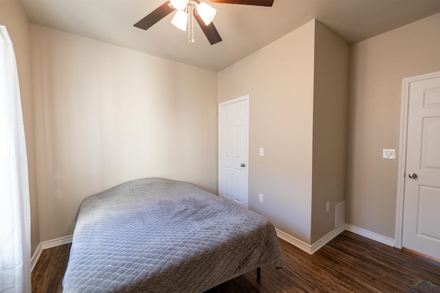 bedroom with ceiling fan and dark hardwood / wood-style floors