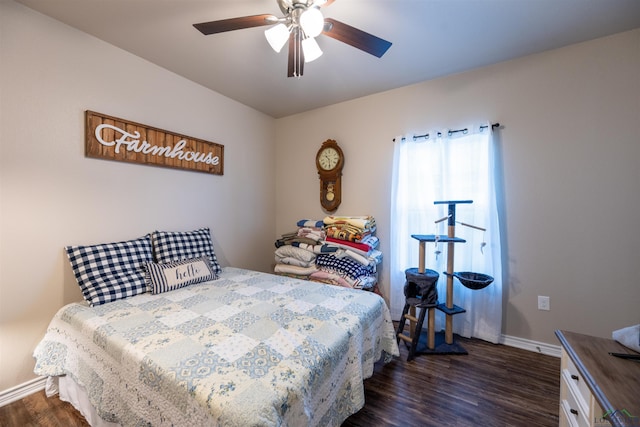 bedroom with ceiling fan and dark hardwood / wood-style flooring