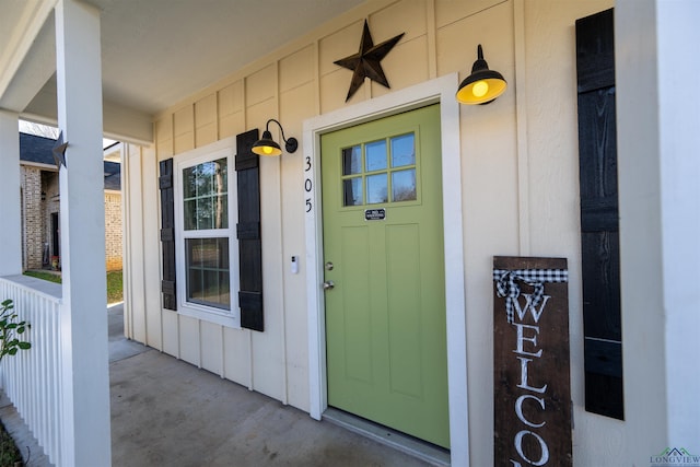 doorway to property with a porch