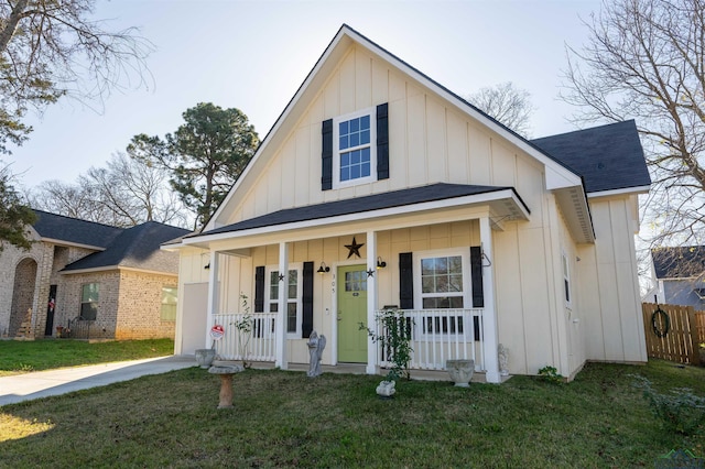 view of front of property with covered porch and a front yard