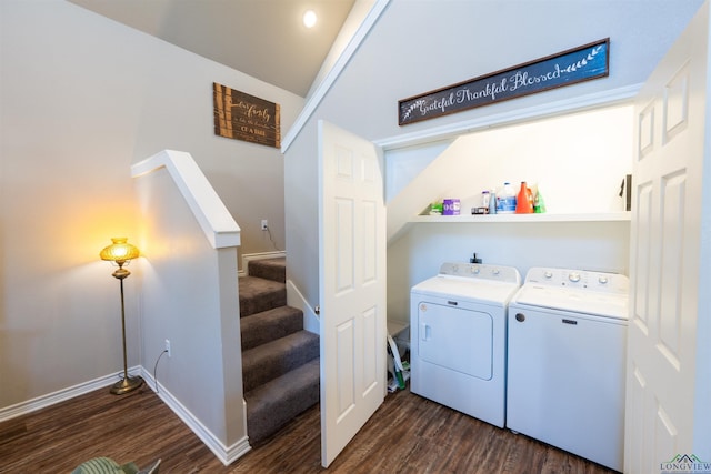 laundry area with washer and dryer and dark hardwood / wood-style floors