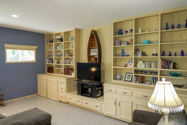 sitting room featuring a textured ceiling