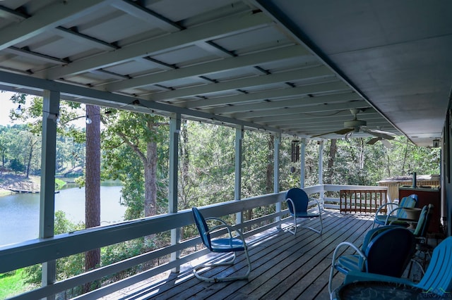 deck featuring a water view and ceiling fan