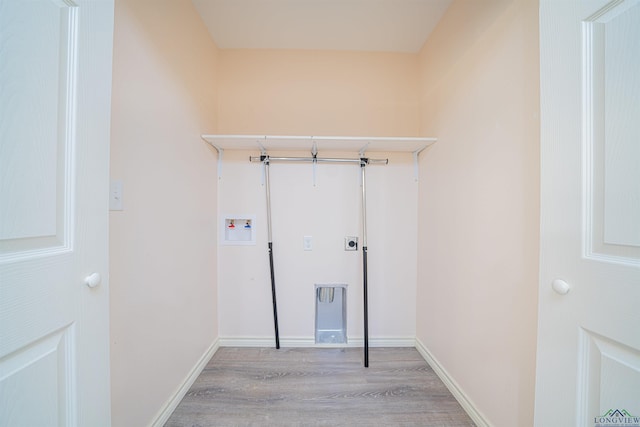 washroom featuring washer hookup and light wood-type flooring