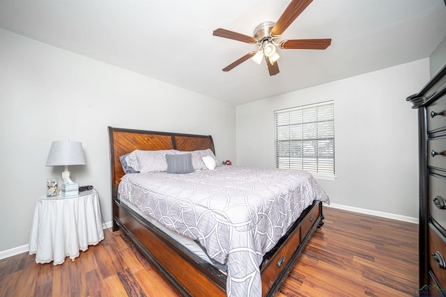 bedroom featuring ceiling fan and dark hardwood / wood-style flooring