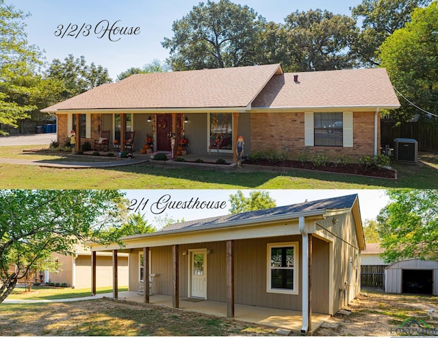 view of front facade featuring cooling unit, a front yard, and a shed